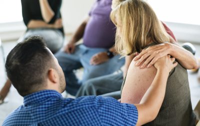 Diverse people in a support group session Diverse people in a support group session